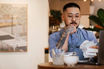 Bar Owner Calculating ROI on ID Scanner Investment